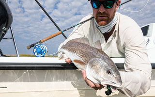 man holding a fish