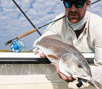 man holding a fish