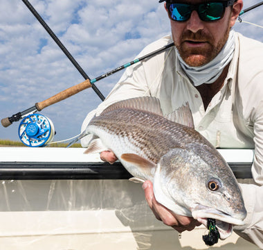 man holding a fish