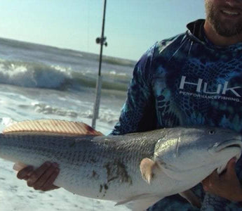 Angler Surf Fishing Redfish